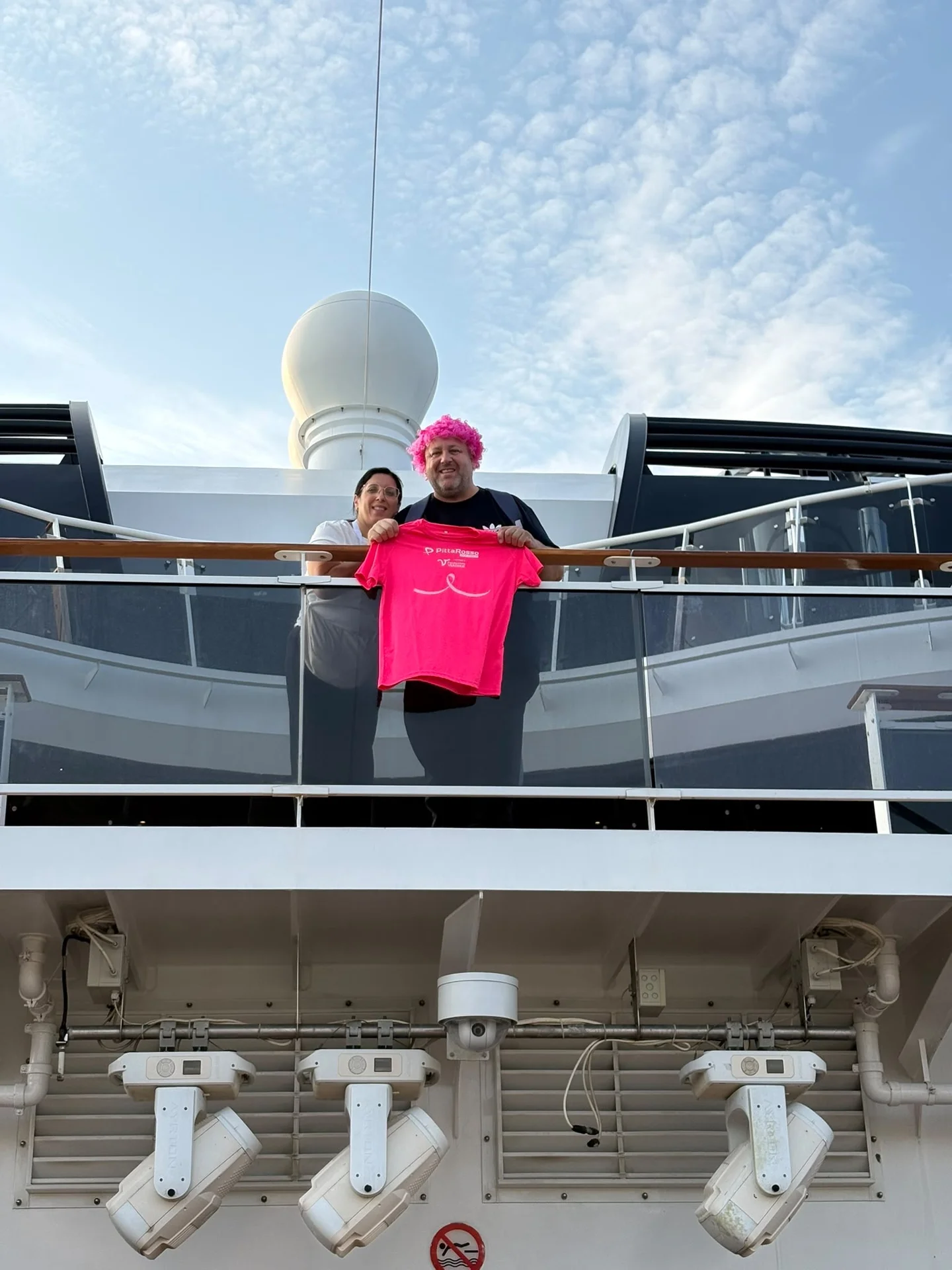A participant wearing pink on the terrace