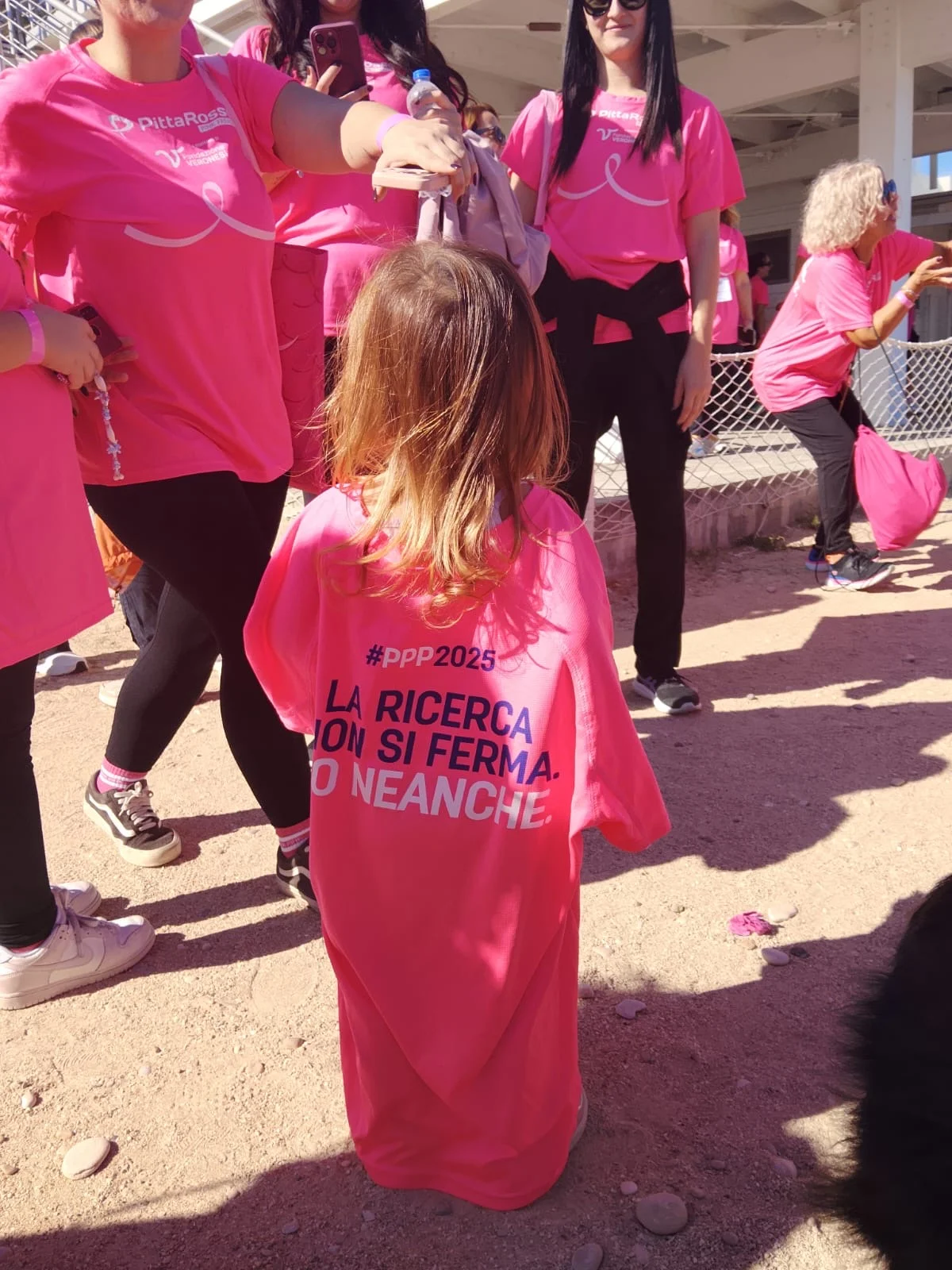 A young participant wearing the research T-shirt